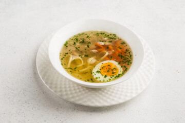 chicken broth with noodles and egg