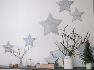 The design of the wall, the interior. Star. Dry branches. Candles