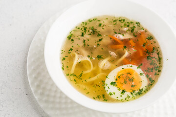 chicken broth with noodles and egg
