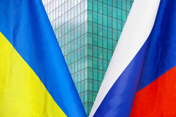 Flag of Ukraine and Russia flag close-up. The concept of political and economic relations of states. Sanctions