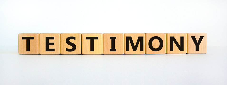 Testimony symbol. Wooden cubes with the word 'testimony'. Beautiful white background. Business, testimony concept. Copy space.