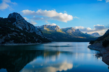 Beautiful sunset at the lake El Gorg Blau in the Sierra de Tramuntana. Palma de Mallorca, Spain