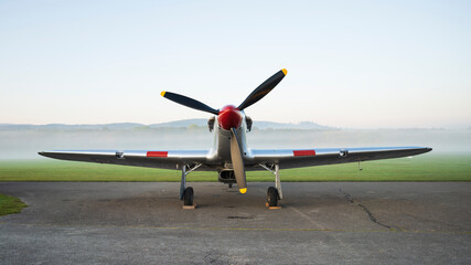 Vintage Hurricane aircraft stands in the morning haze