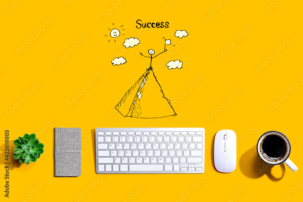 Poster standing on the top of a mountain with a computer keyboard