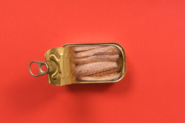 can of mackerel on red background