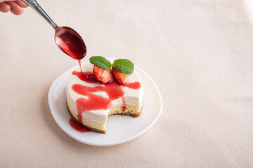 Fruit cheesecake, with fresh strawberries and berry juice. Classic dessert