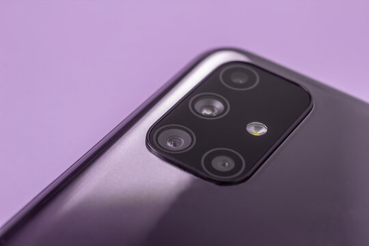 A Modern Smartphone With Multiple Camera Lenses And A Built-in Close-up Flash