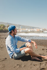 person sitting on the beach