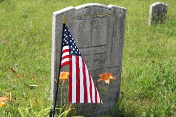 american flag on the grave