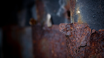 Old corrugated iron sheet of brown color with numerous traces of rust, texture background.