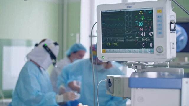 surgical anesthesia machine in operating room shows indicators of life and pulse