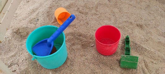 Fototapeta na wymiar kids toys in the sand