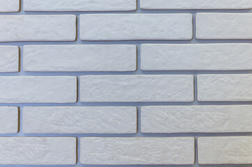 Decorating the walls of the house under white brick.