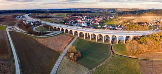 Bavarian Arched Bridge in famous Holledau region with a city shape at the background