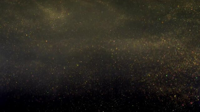 Golden dust background for creative glowing compositions, overlay video with shiny dust particles in random motion