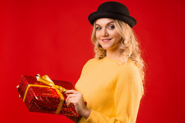 Winter holiday, a young woman in knitted clothes and a bowler hat