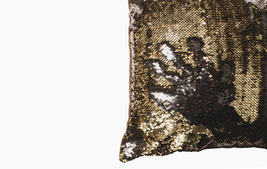 Fragment of a small pillow in a pillowcase with metal petals
