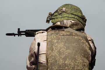 Russian military police soldier in desert uniform. Patch on the shoulder flag of Russia, arms of...