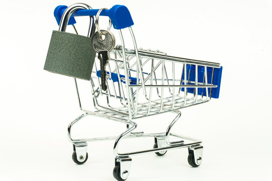 Grocery cart. The lock and keys hang on the handle. Isolated