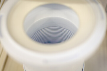 Connection adapter to the toilet (drain).