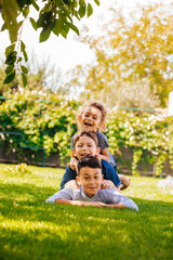 Portrait of three little children as a tower - 422630012