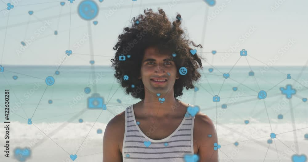 Poster animation of network of digital icons over happy man smiling on beach