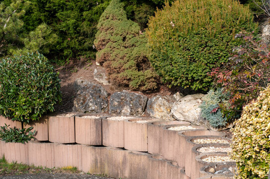 concrete elements filled with gravel at a garden wall