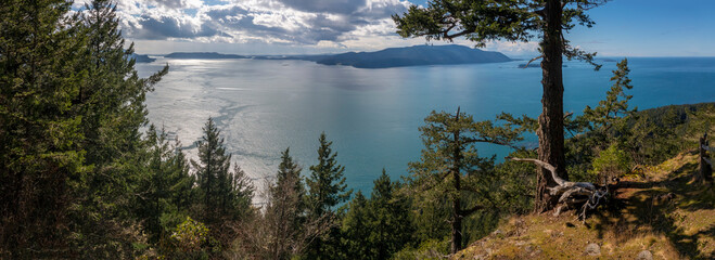 Western View of the San Juan Islands and the Salish Sea from Lummi Island, Washington. The top of Lummi Mountain provides a panoramic view of Orcas Island during a lovely springtime sunny day.