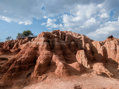 landscape of eroded rocks and ravines in the desert.