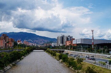 Fototapeta premium Panoramic view from a bridge over the river of the city of Medellin