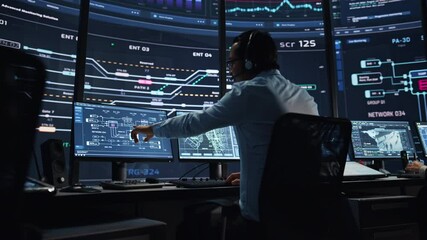 Professional IT Technical Support Specialists and Software Programmer Working on Computers in Monitoring Control Room with Digital Screens with Server Data, Blockchain Network and Surveillance Maps - Powered by Adobe
