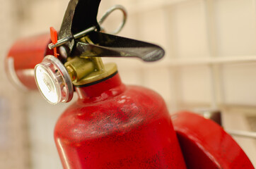 Red fire extinguisher on the wall.