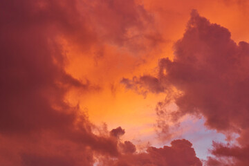 Incredible red sunset clouds against the blue sky