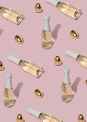 Pattern with golden eggs and  bottles of champagne on pastel pink background. Minimal Easter composition.