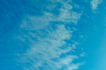 Fototapeta na wymiar Dark turquoise sky with clouds.