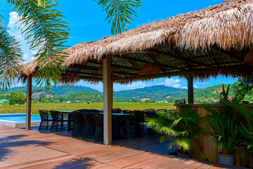 Lounge with a tropical mountain landscape. Terrace with a shelter by the pool overlooking the mountains.