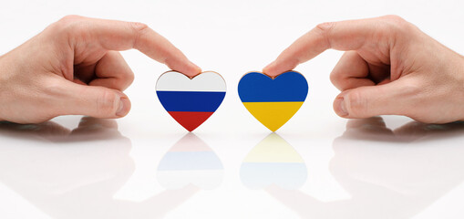 The concept of friendship and diplomatic relations between Russia and the Ukraine. Two male hands...