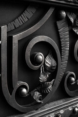 forged elements of a metal fence of gray tones