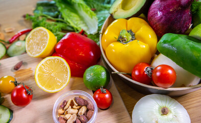 Healthy food clean eating selection: fruit, vegetable, seeds, superfood, leaf vegetable and mediterranean dishes. Detox and clean diet. Foods high in vitamins, minerals and antioxidants.