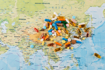 pile of medicines on map, ecology concept