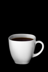 White cup of tea or coffee isolated on absolutely black background