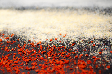 Texture of different spices on a black background