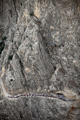 People watching the Dark Canyon view on the rock in Kemaliye (Egin), Erzincan, Turkey.