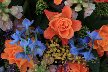 Orange and blue flower arrangement for a wedding