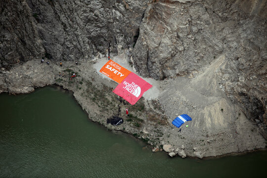 KEMALIYE, TURKEY - JUNE 23: Base Jump after paragliding on the Dark Canyon in district of Kemaliye (Egin) on June 23, 2012 in Erzincan, Turkey. Kemaliye is extreme sport center in Eastern Turkey.