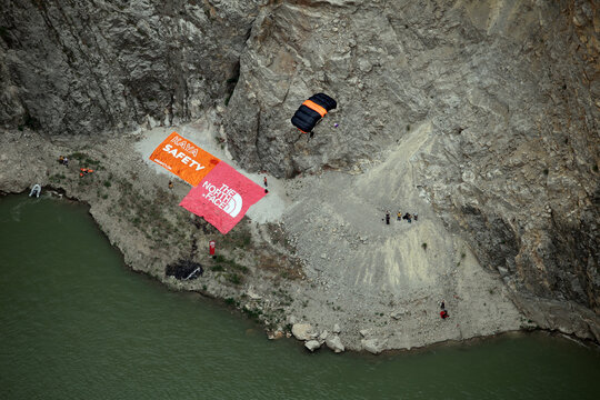 KEMALIYE, TURKEY - JUNE 23: Base Jump after paragliding on the Dark Canyon in district of Kemaliye (Egin) on June 23, 2012 in Erzincan, Turkey. Kemaliye is extreme sport center in Eastern Turkey.