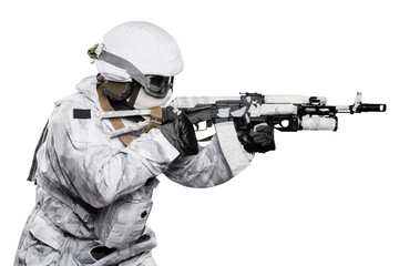 Male in soldier (snow camouflage) uniform with weapon. Shot in studio. Isolated with clipping path...