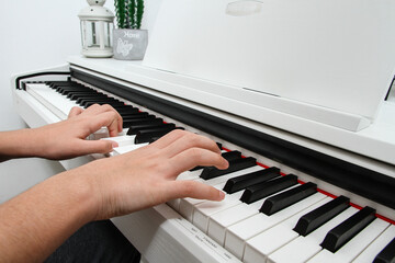 Fototapeta na wymiar child playing piano