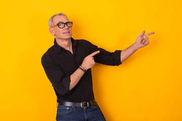 senior man with glasses pointing isolated