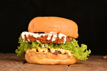 A hamburger (also burger for short) is a sandwich consisting of one or more cooked patties of ground meat, usually beef, placed inside a sliced bread roll or bun.
